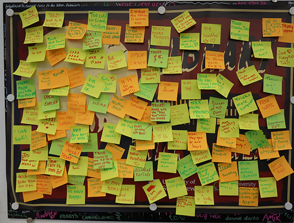 Orange and green post-it notes covering the feedback board