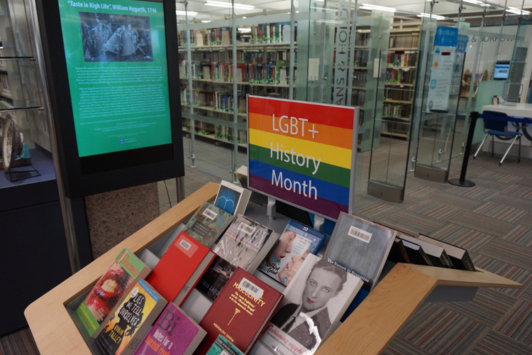 Image of books display and posters for LGBT+ History Month