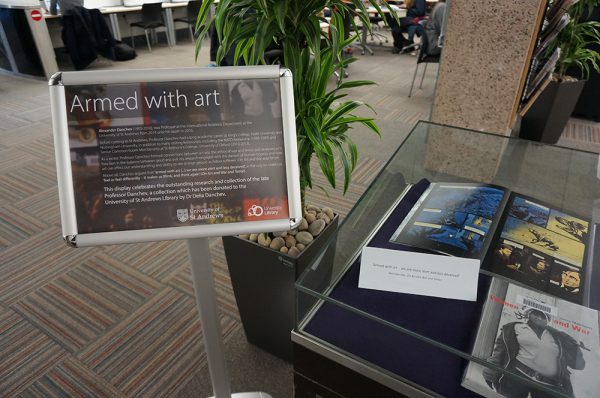 armed with art danchev display sign