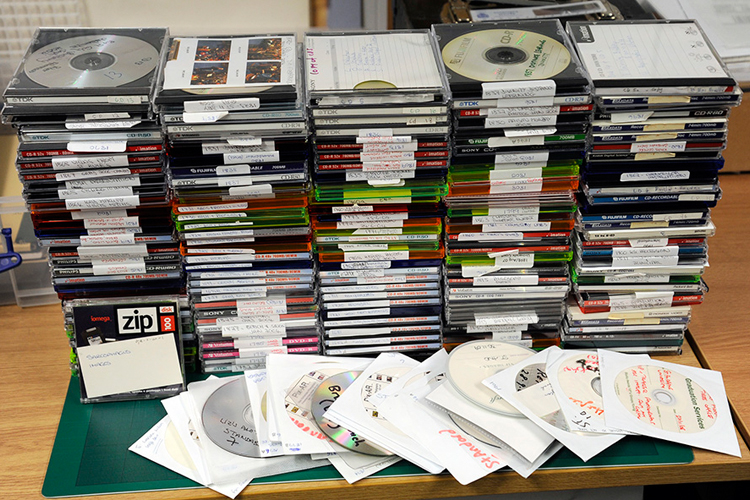 photo of stacked CDs ready to be digitised